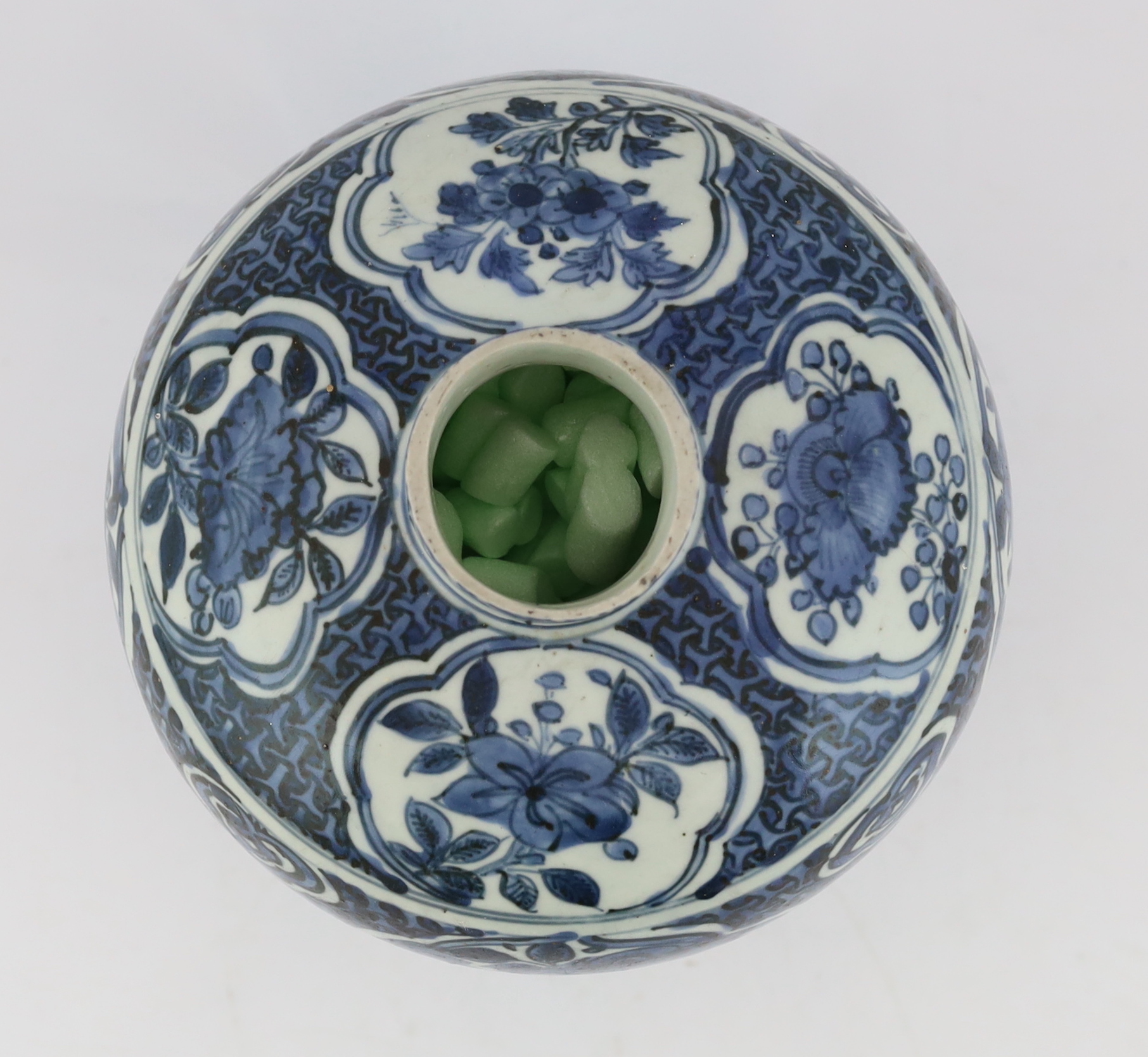 A Chinese late Ming blue and white jar, Wanli period, neck reduced